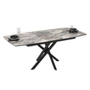 Tavolo allungabile Filis con piano effetto marmo arabesque nero lucido e gambe in metallo nero