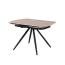 Tavolo girevole allungabile Kitti con piano in ceramica effetto marmo travertino e gambe in metallo nero