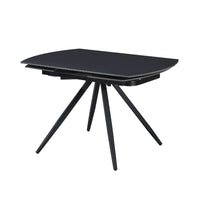 Tavolo girevole allungabile Kitti con piano in ceramica nero opaco e gambe in metallo nero