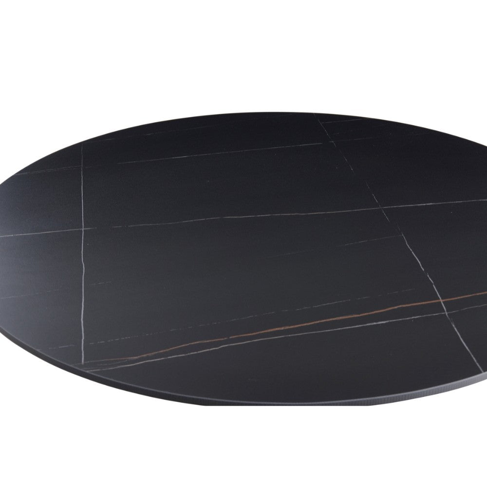 Tavolo rotondo Dot con piano in ceramica effetto marmo nero opaco con particolari oro e gamba nera